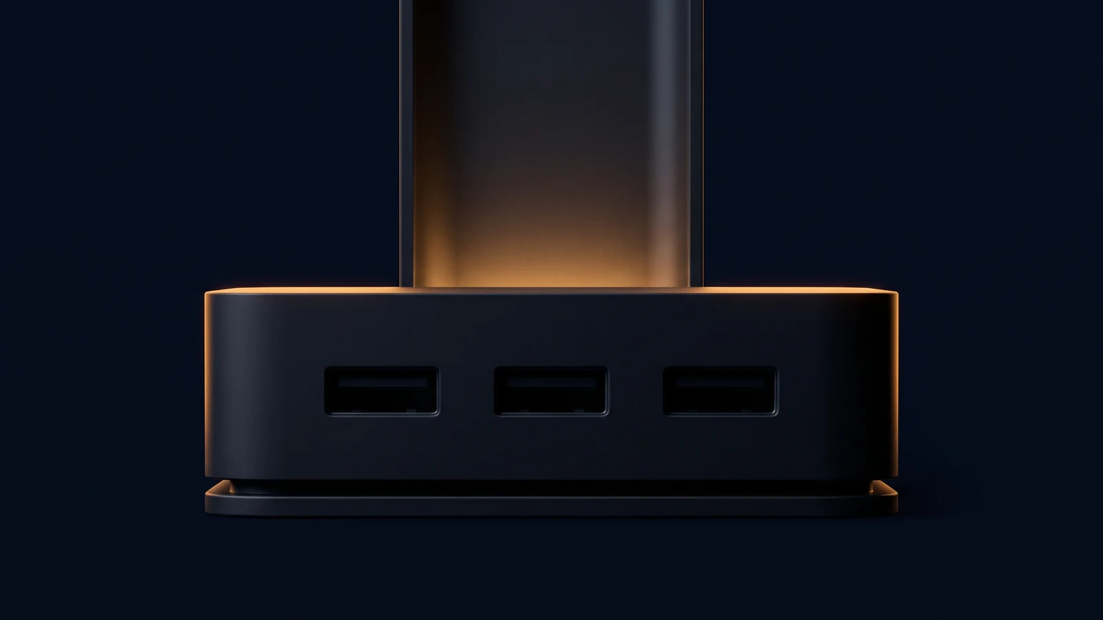 A broad blank dark connection hub resting on a low rail in a deep blue void, three identical blank rectangular ports across its front all dark, with one wide blank upright channel rising behind it washed warm amber from a light source low inside it