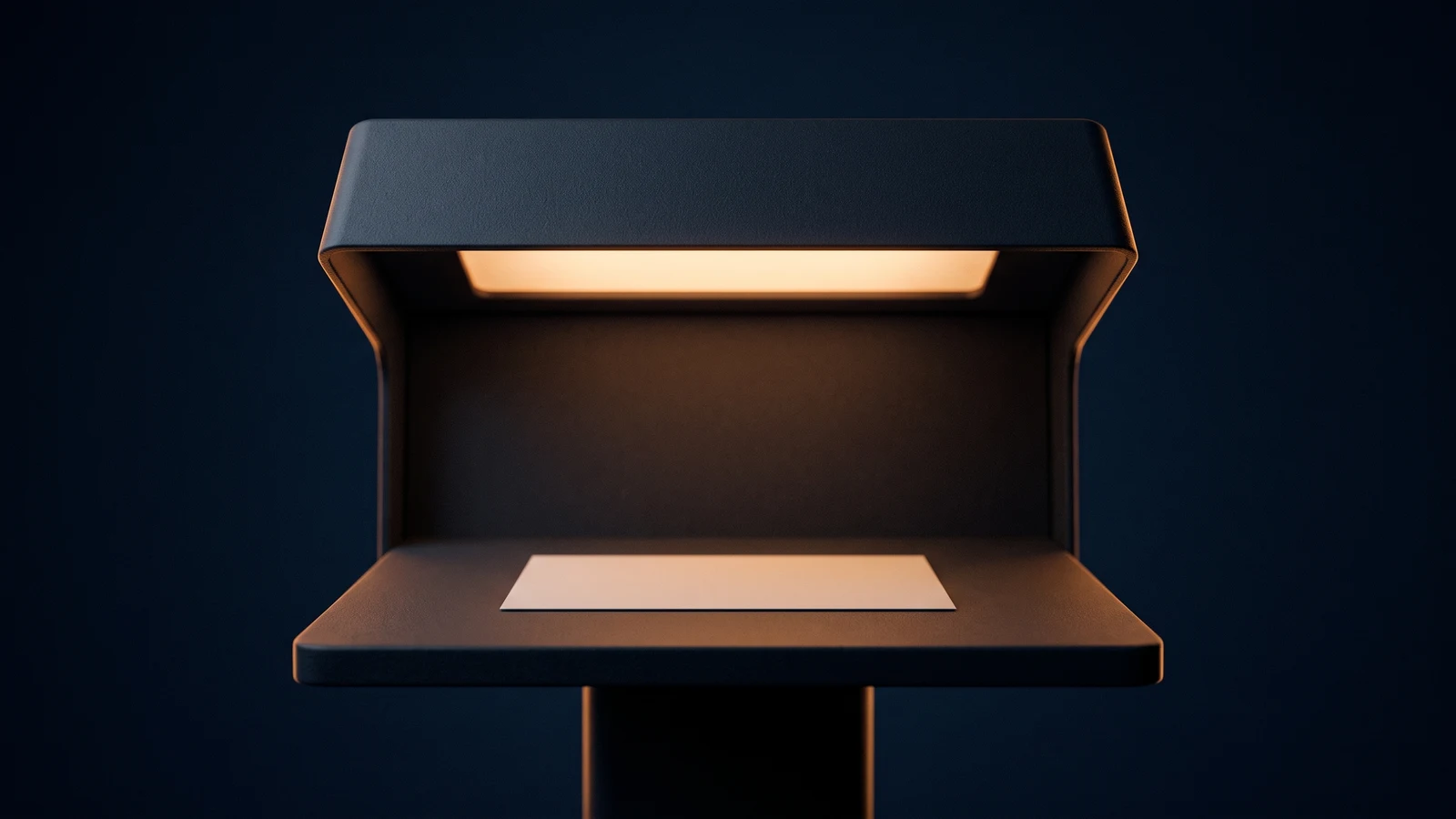 A single document verification lamp of matte near-black charcoal standing dead-on in a deep blue void, a broad blank hood across the top holding a warm amber light source that washes down onto a wide flat inspection shelf beneath it, one completely blank landscape card lying alone on the lit shelf
