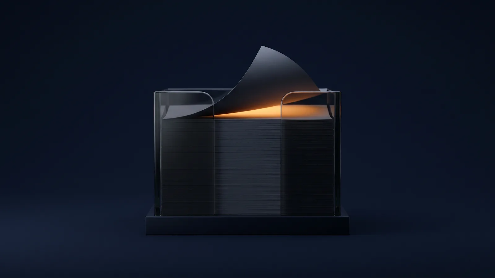 A broad thick pad block of dark smoked glass standing on a low base in a deep blue void, built from a tall stack of many identical blank leaves, the single topmost leaf lifted and curled forward well clear of the stack with the empty gap beneath it glowing warm amber from inside the block