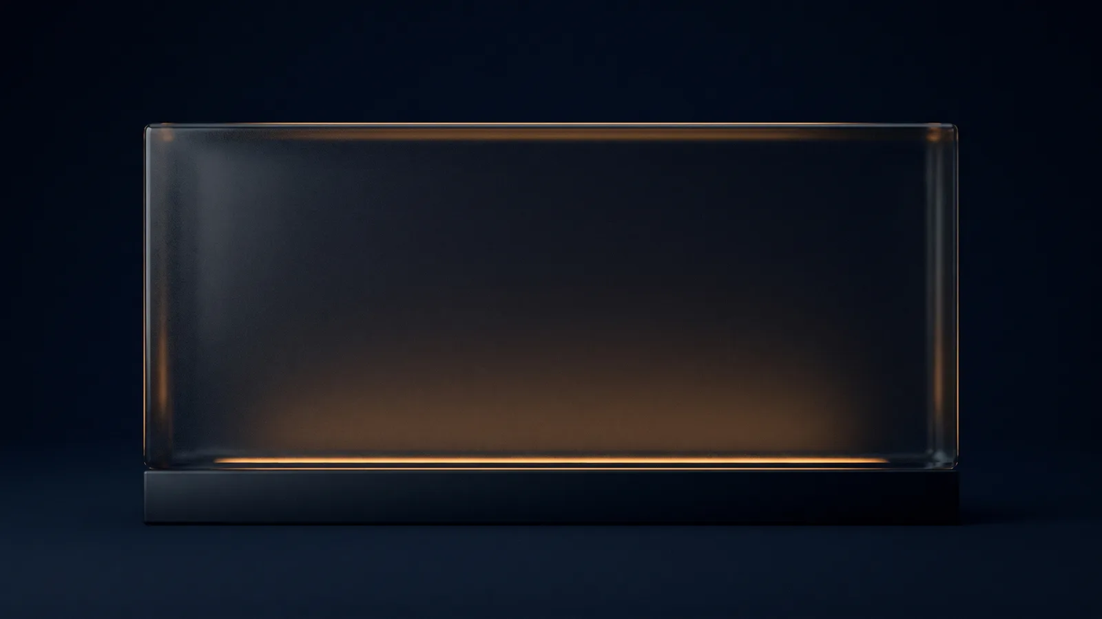 One broad desk name block of dark smoked glass standing on a low plinth in a deep blue void, its wide front face completely blank and close in value to the background, traced by a soft warm amber rim along its top and bottom edges with a low warm light inside the plinth washing the underside