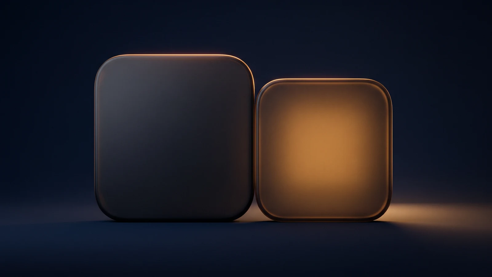 Two rounded square interface tiles of dark smoked glass standing side by side on an unseen floor in a deep blue void, the larger left tile completely blank and dark with only a warm amber rim along its top edge, the smaller right tile equally blank and glowing warm amber from within