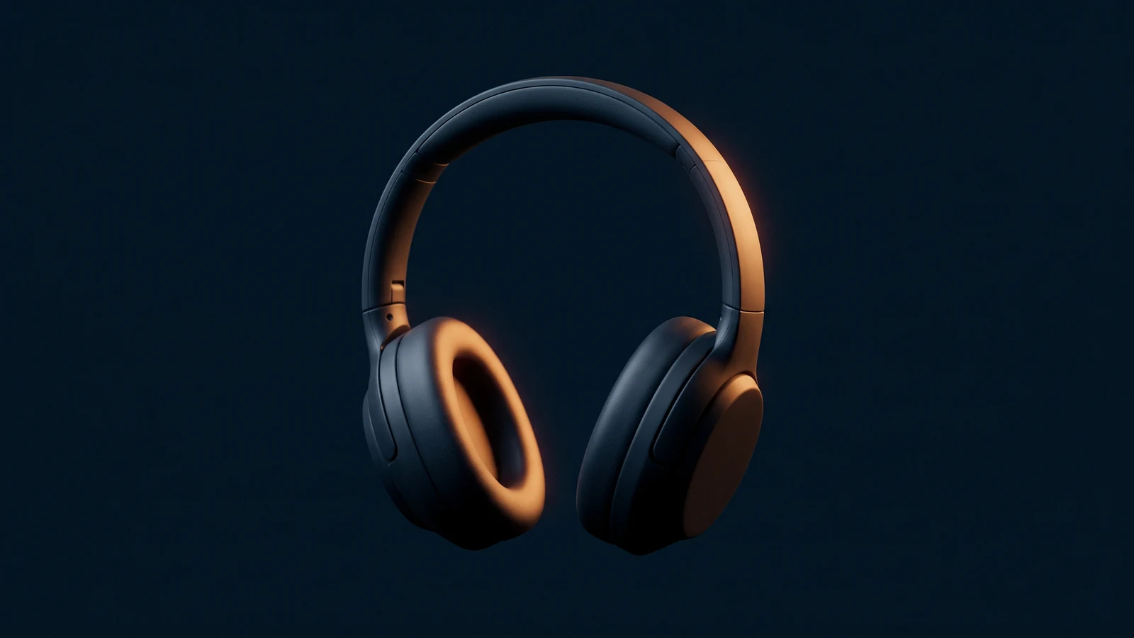 A pair of over-ear headphones of matte near-black glass standing upright in a deep blue void, the left earcup glowing warm amber from inside the pad, the right earcup dark but present