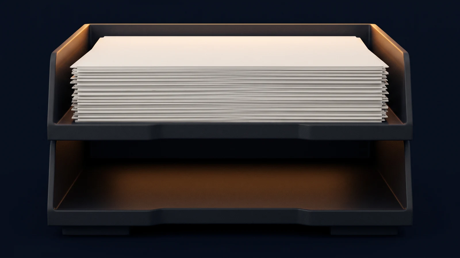 A pair of broad stacked desktop document trays of matte near-black charcoal standing dead-on in a deep blue void, the upper tray heaped with a tall stack of identical completely blank sheets rimmed with warm amber light, the lower tray completely empty with its floor washed dimly amber