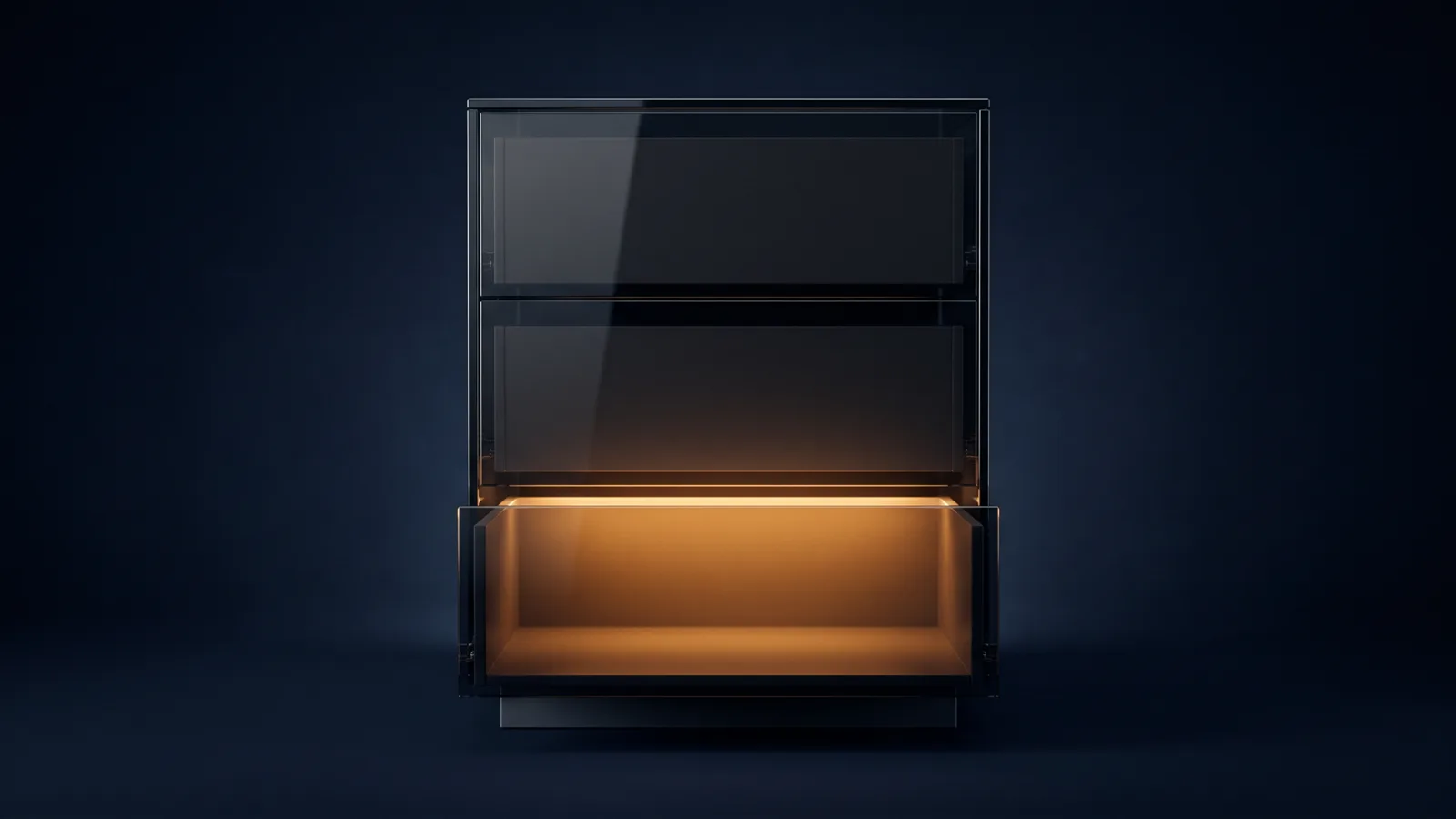 An upright cabinet of dark smoked glass standing dead-on on a low base in a deep blue void, holding three identical stacked drawers with completely blank fronts, the bottom drawer pulled well open with warm amber light welling up out of its empty interior and the two drawers above it closed and dark