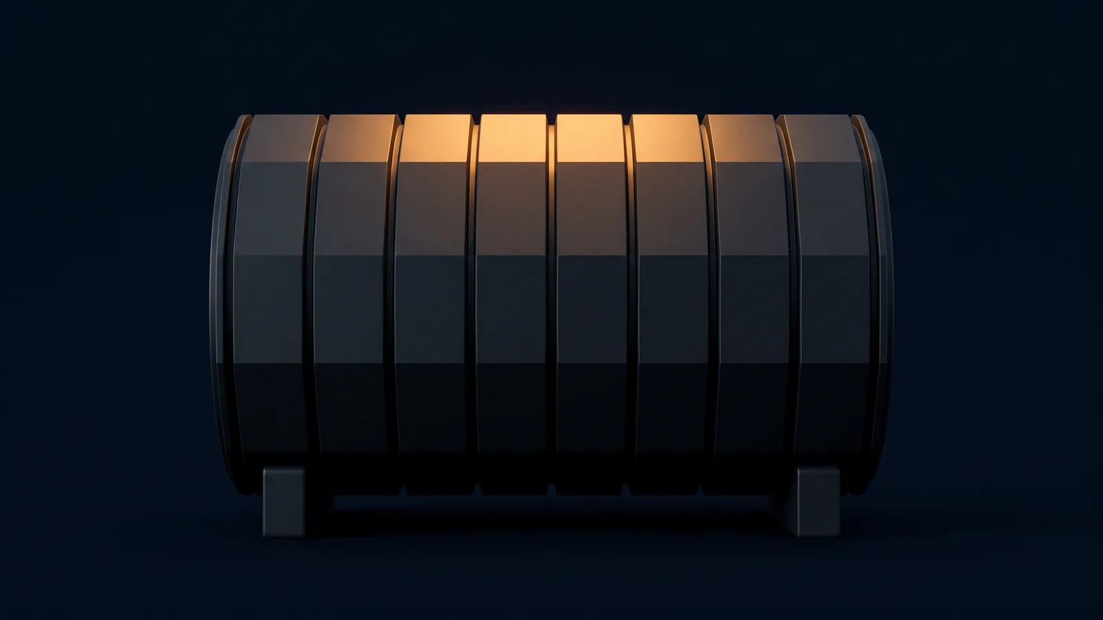 A large blank cylindrical drum of dark smoked charcoal resting on two low supports in a deep blue void, its curved face divided into identical unmarked facets by deep grooves, every facet dark except the single course along the top washed warm amber