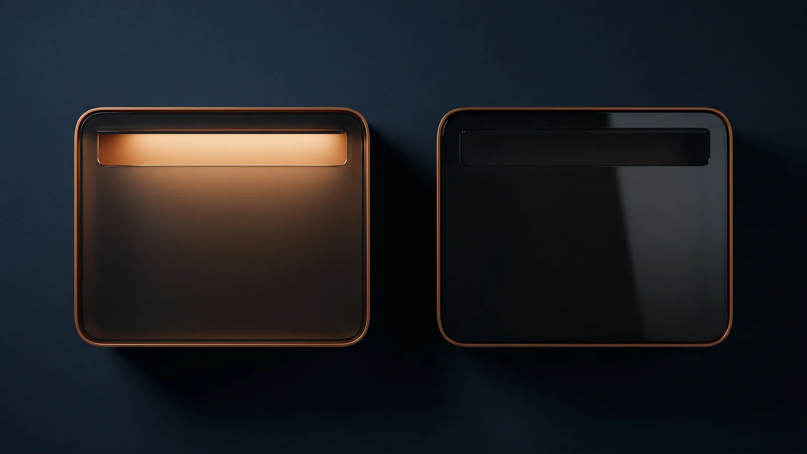 Two identical dark glass wall mailboxes side by side on a deep blue wall, each with a thin amber rim and one wide blank letter slot, the left slot glowing warm amber while the right one stays dark
